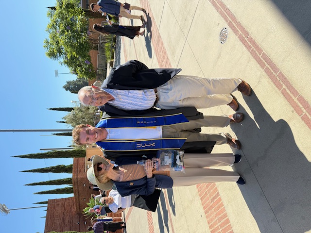 With grandparents at UCLA graduation